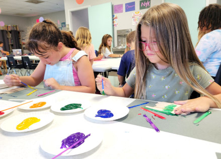 students painting