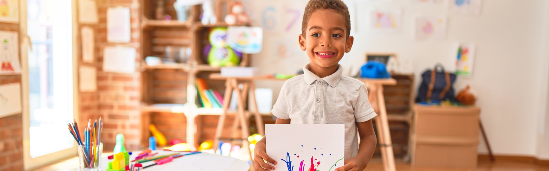 young boy with his painting